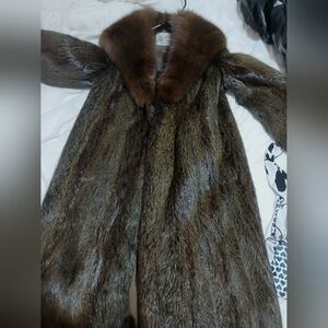 A faux fur coat from Snider with paper of authenticity. Appraised in 82 at 4000